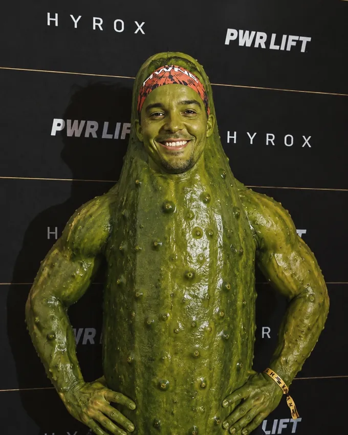 Brandon Barnes in a pickle costume at a HYROX event